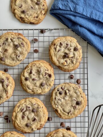 Chocolate chip toffee cookies cooling on a wire rack