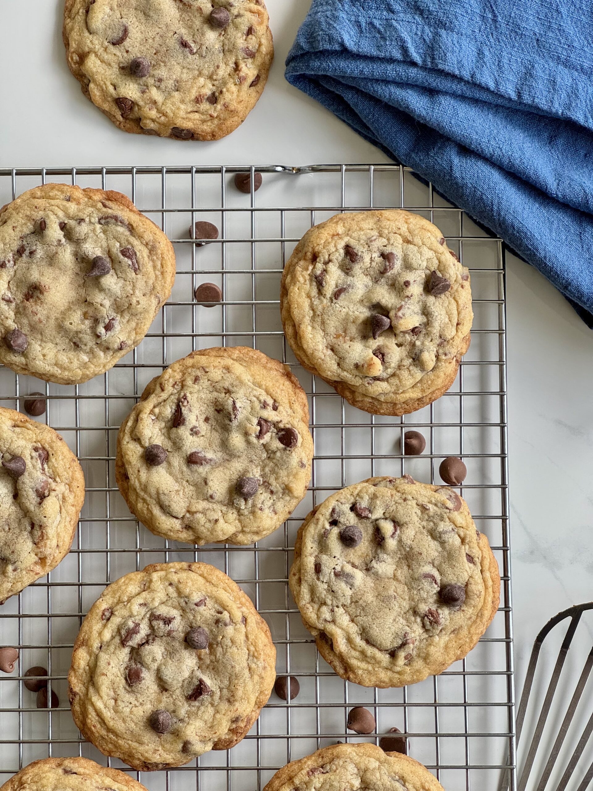 Chocolate chip toffee cookies cooling on a wire rack